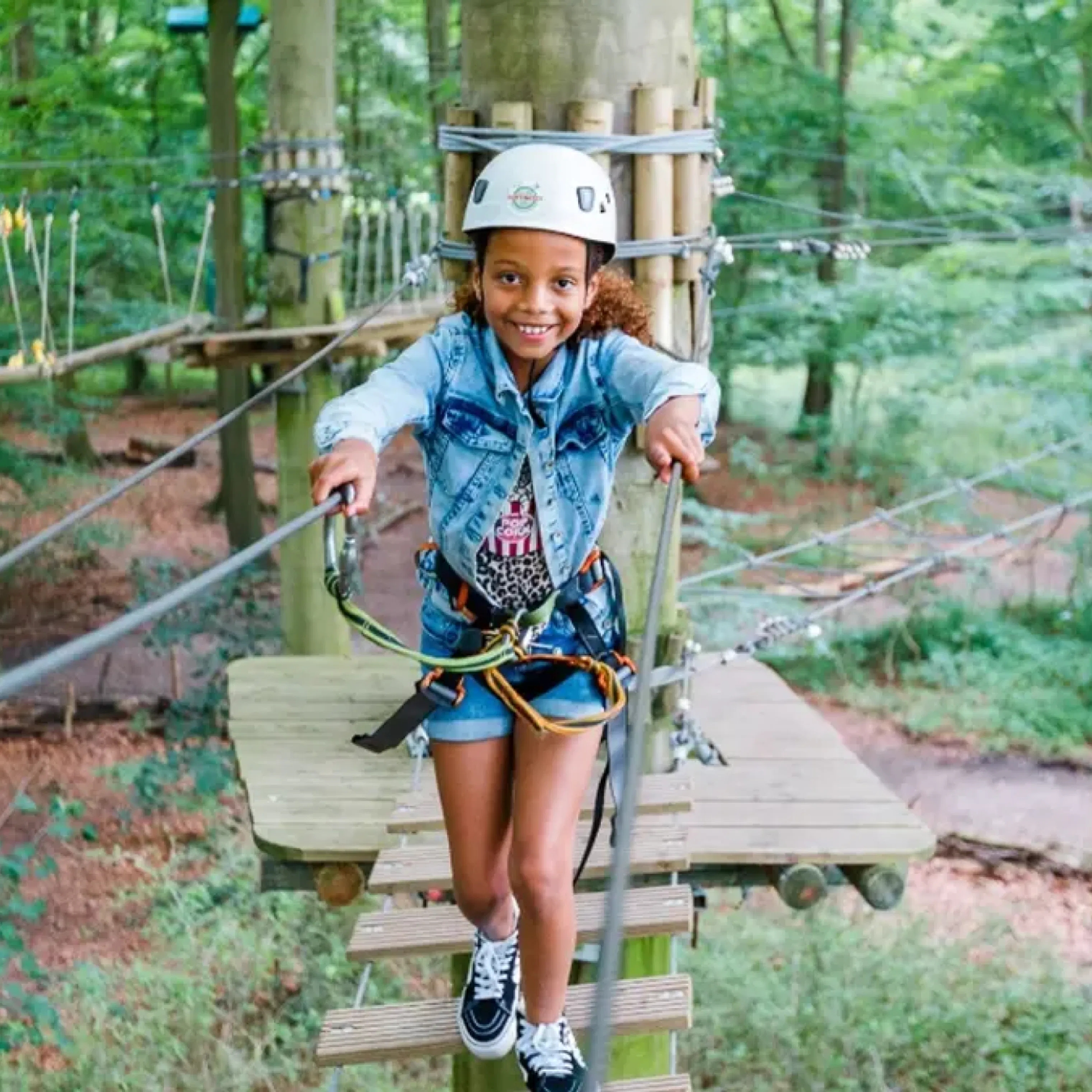 Girl climbs at Fun forest